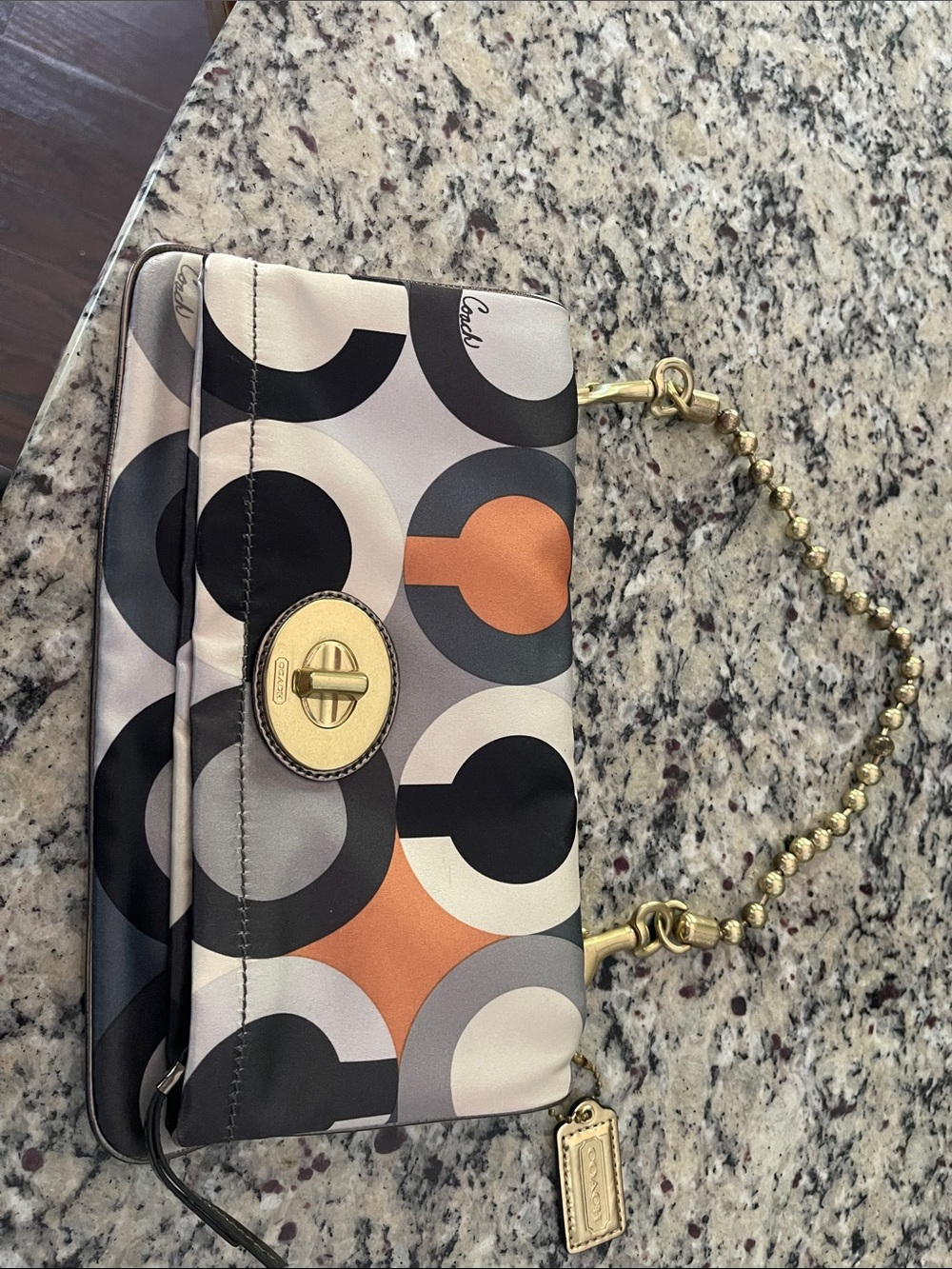Coach Circle-Print Wristlet in Black, Gray & Orange with Gold Hardware